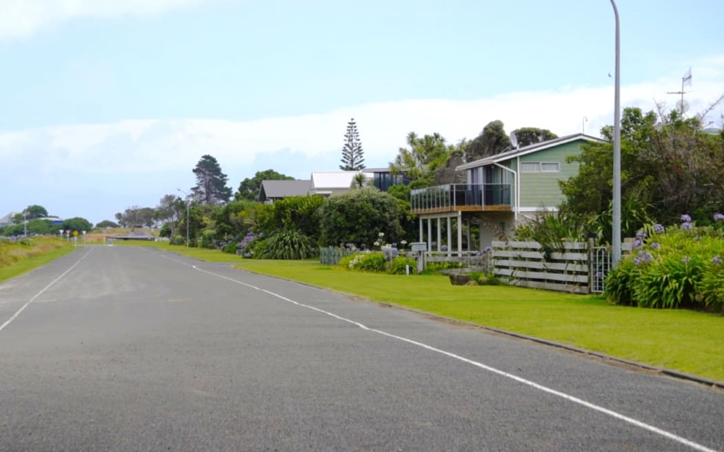 Homes along the road closest to Mahanga Beach are not yet under threat.
