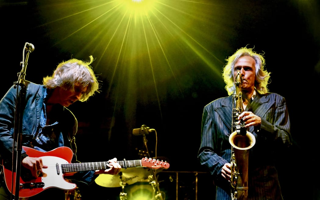 Chris White of Dire Straits, right
