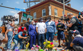 Terrence Floyd, at centre, the brother of George Floyd at the site where George Floyd died, in Minneapolis. 1 June 2020.