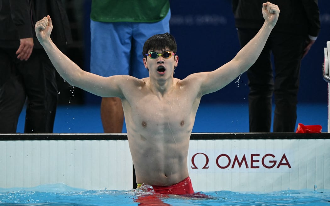 China's Pan Zhanle reacts after winning gold and breaking a world record in the final of the men's Olympic 100m freestyle final in Paris.