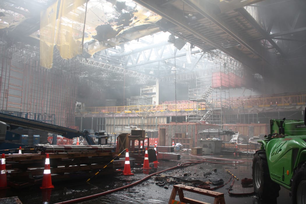Plenary Theatre main floor, at the back of the theatre you can see the raked seating. Above you can see part of the collapsed roof (which includes gibing and other materials) but you can also see that the physical roof structure is still intact.