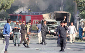 KABUL, AFGHANISTAN - SEPTEMBER 09: Damaged vehicles are seen as people inspect at the site following a bomb attack targeting Afghan Vice President Amrullah Saleh's convoy in Kabul, Afghanistan on September 09, 2020.