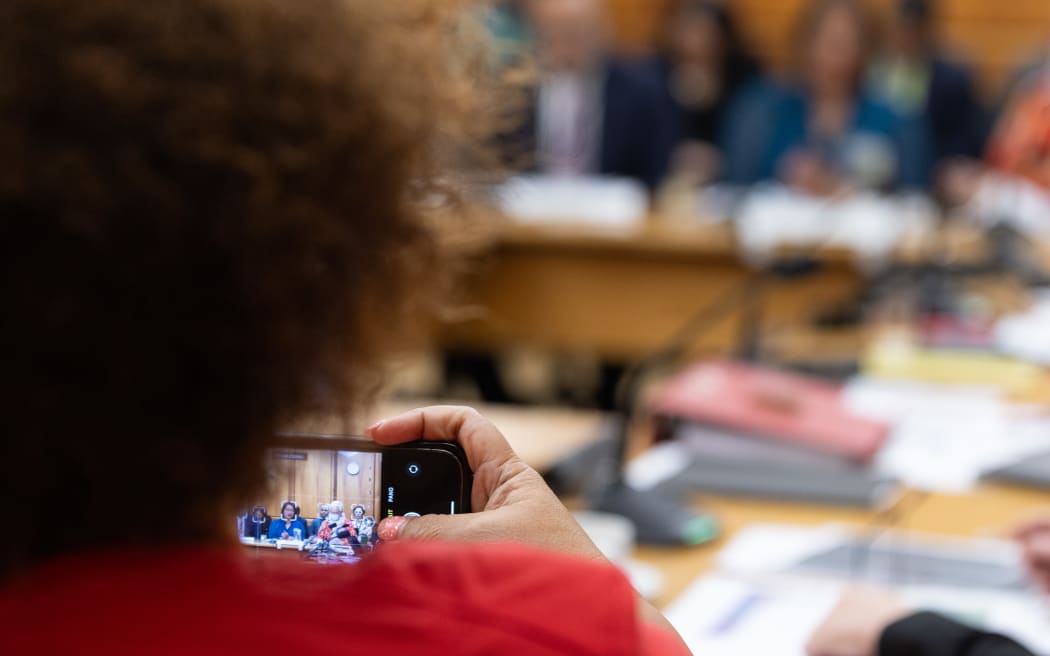 Anahila Kanongata'a takes a snap during the Social Services Select Committees' Estimates Hearings.