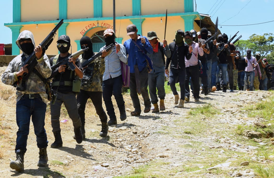 Members of the new self-defence group called "El Machete" parade during their presentation in Chiapas, Mexico on 18 July, 2021.