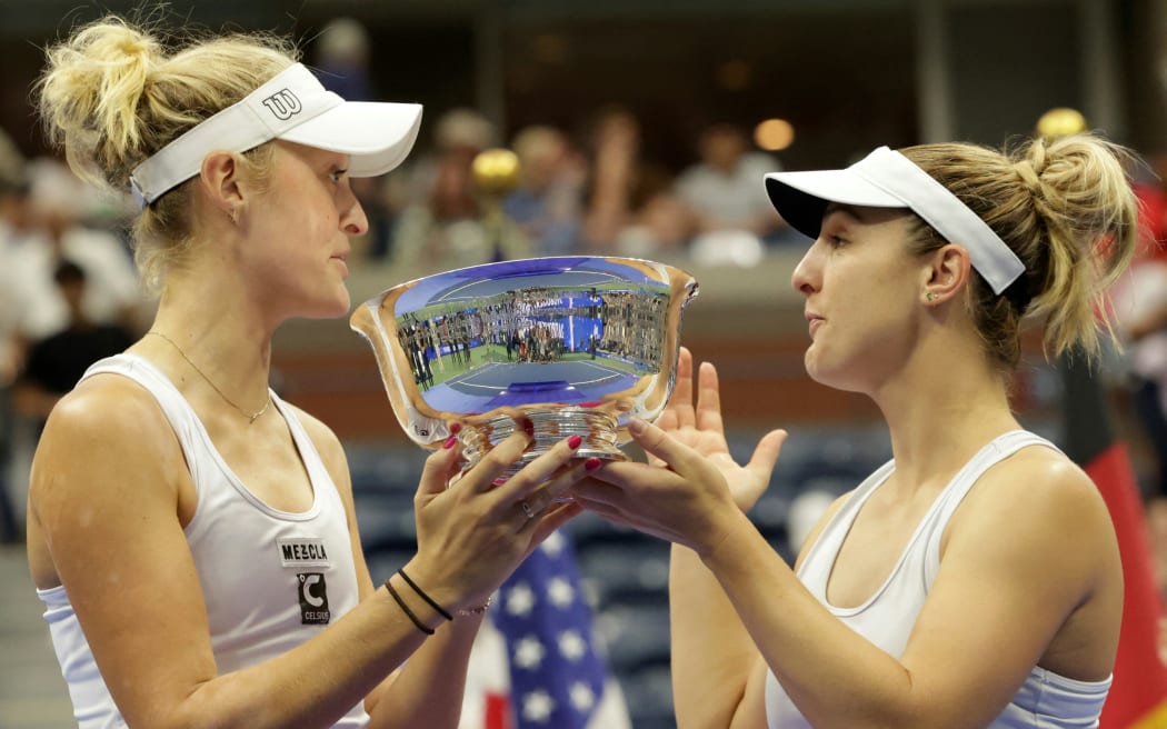 New Zealand's Erin Routliffe and Canada's Gabriela Dabrowski celebrate with the trophy following the US Open tennis tournament women's doubles final match, 2023.