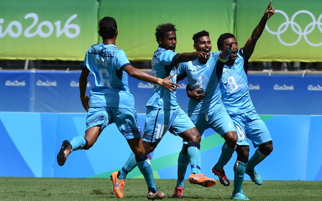 Roy Krishna (2nd R) and teammates celebrate his goal against Mexico at the Rio Olympics.