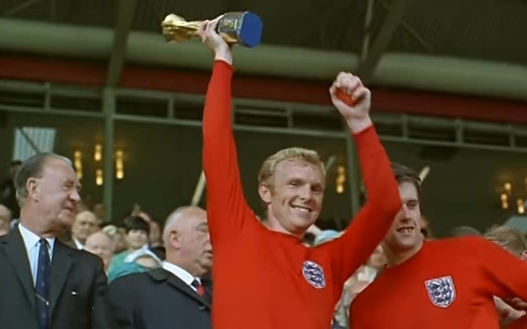 England captain Bobby Moore holds the World Cup aloft at Wembley in 1996.