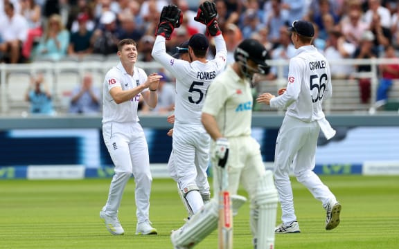 Matthew Potts of England celebrates taking the wicket of Kane Williamson of New Zealand, first Test, Lord's 2022.