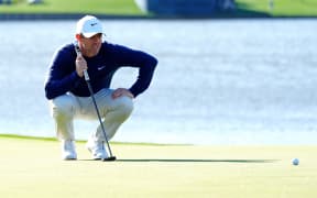 Rory McIlroy lines up his putt on the 18th hole during the aggregate playoff for The Players Championship at TPC Sawgrass in Florida on March 17, 2025.