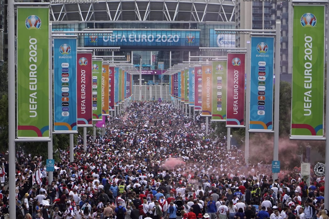 Fans gather at Wembley Stadium ahead of the Euro 2020 final football match between England and Italy in northwest London, 11 July 2021.