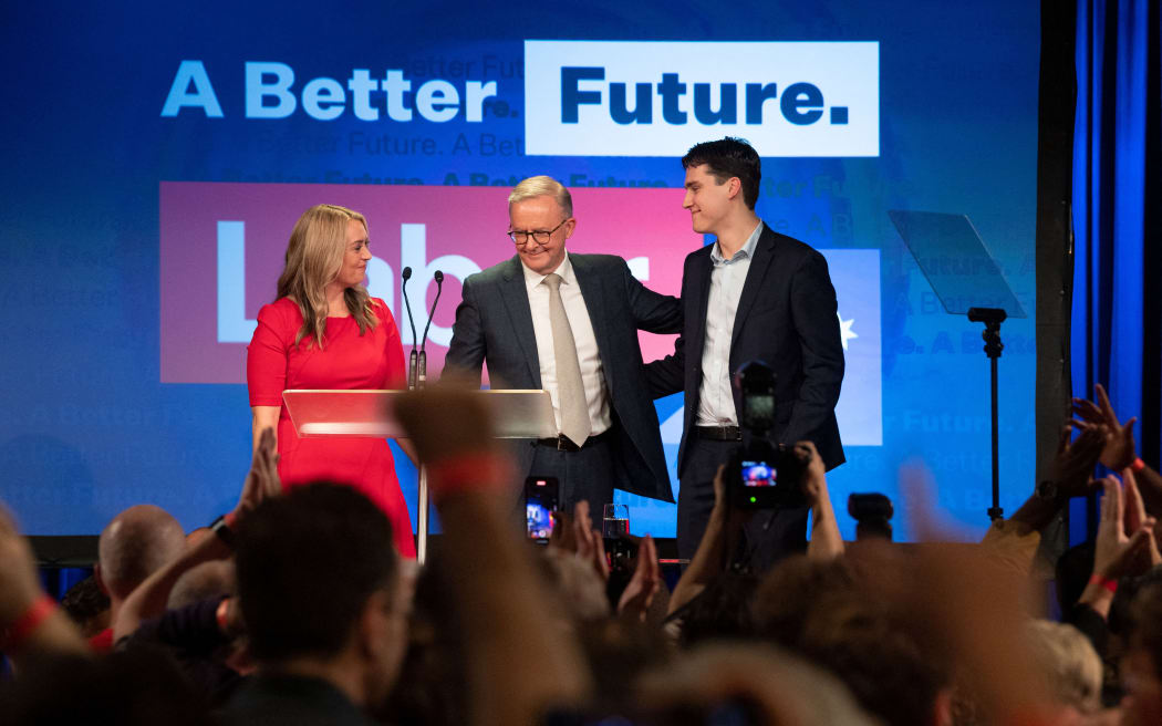 Australian opposition leader Anthony Albanese stands onstage with his partner Jodie Haydon and son Nathan Albanese during a reception after winning the 2022 general election in Sydney on 21 May 2022.