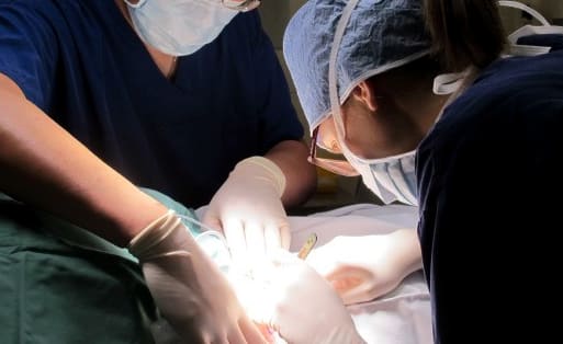 Dr Anthony Yung (left) with registrar Dr Georgina Harvey excising a skin cancer. For Karen Browns dermatology story