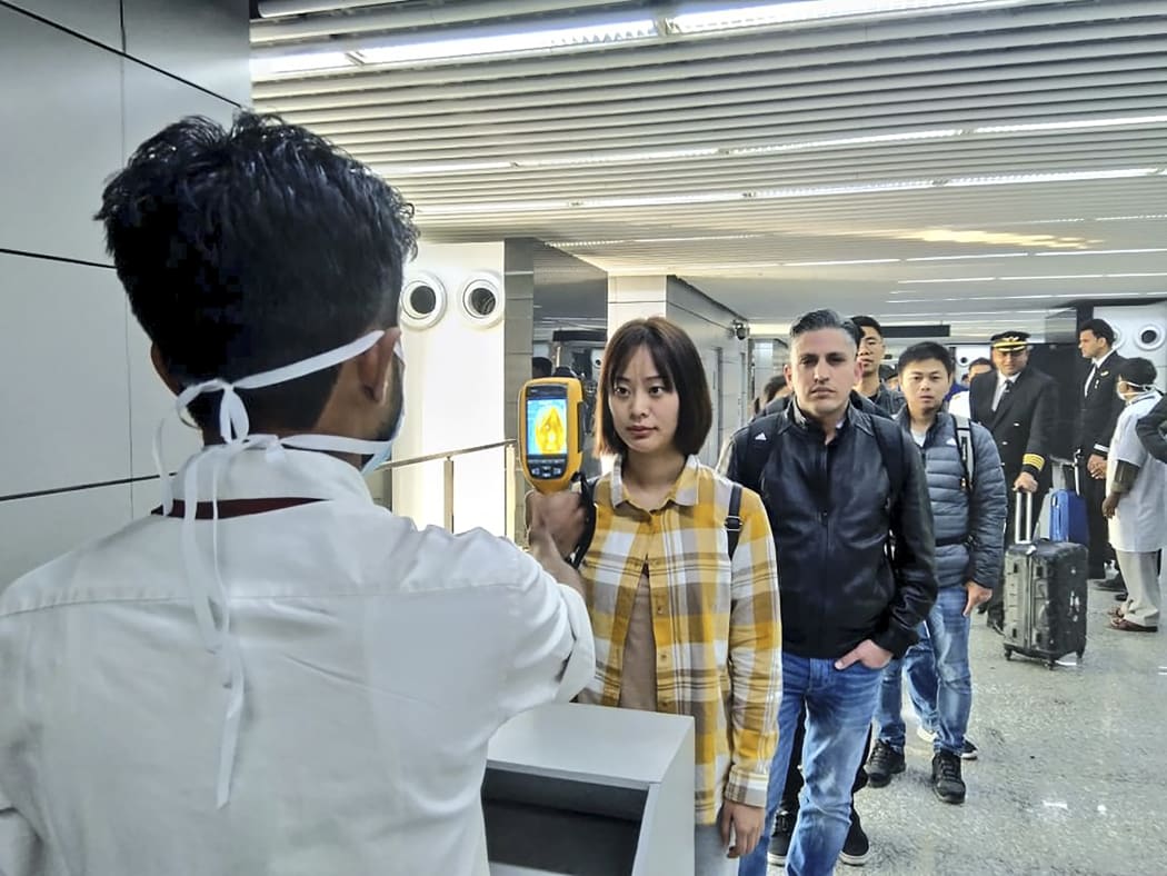 The Ministry of Civil Aviation uses a thermographic camera to screen the head of people at Netaji Subhash Chandra Bose International Airport in Kolkata following the outbreak of CoV2019.