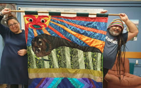 Ron Te Kawa (right) makes art from recycled and reclaimed fabric including whakapapa quilts in community halls and marae.
