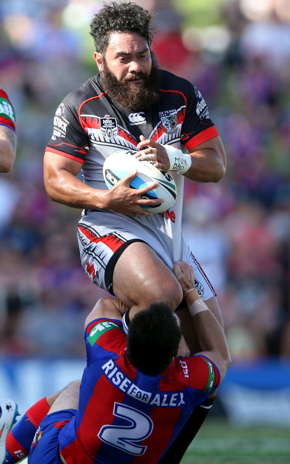 Newcastle winger James McManus tackes the Warriors Konrad Hurrell head on.