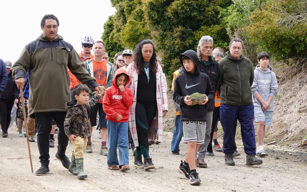 Te Tii Marae chairman Ngatikawa Taituha (left) leads a crowd of eager riders to the new jump park ahead of Sunday’s opening.