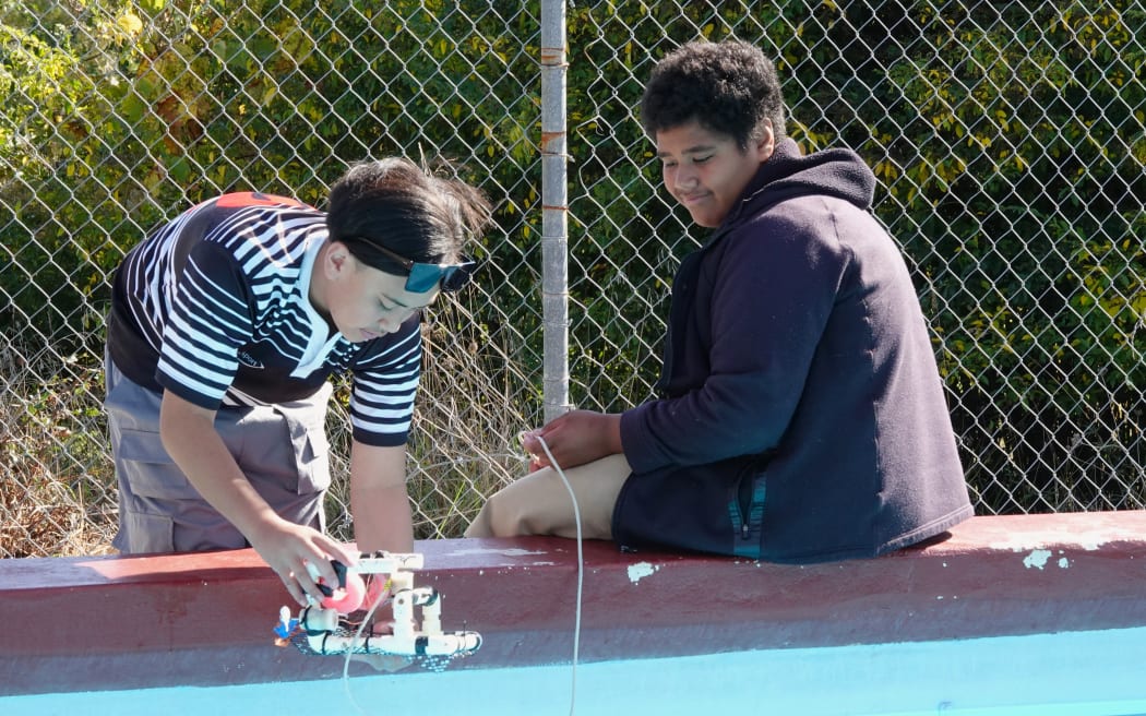 Motatau 12-year-olds Te Maioha Tipene, left, and Zacchaeus Tua test their aquabot in the school pool.