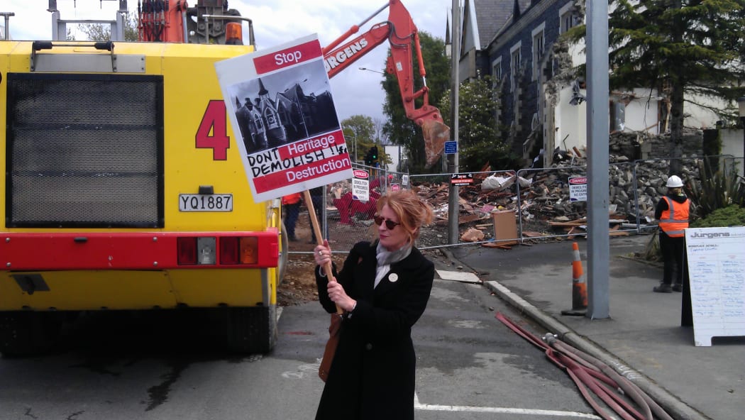 A protester at the Cranmer Courts site. Work began to demolish the heritage building on Thursday.