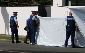 Police at the scene of an unexplained death on Opawa Rd in Christchurch.