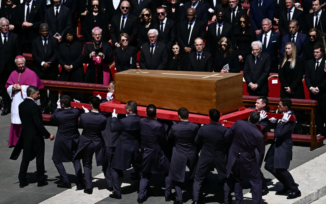 Pallbearers carry the coffin during late Pope Francis' funeral ceremony at St Peter's Square at the Vatican on April 26, 2025. (Photo by Filippo MONTEFORTE / AFP)
