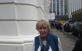 Susan Austen leaves court after denying three charges connected with assisted suicide.