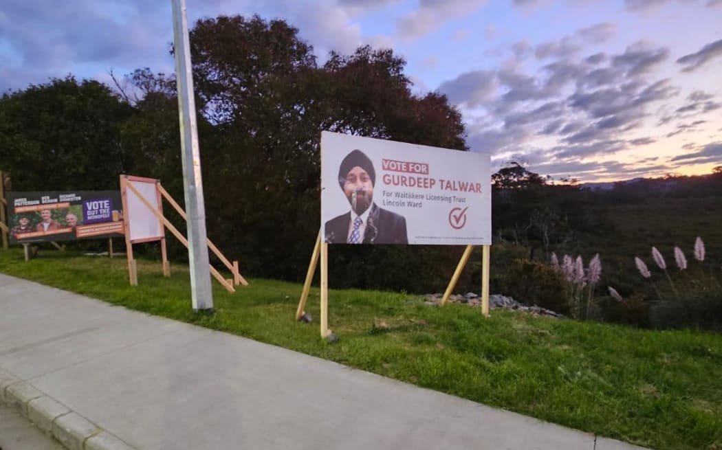Damaged billboards of Gurdeep Talwar, contesting the Waitākere Licensing Trust’s Lincoln ward seat as an independent