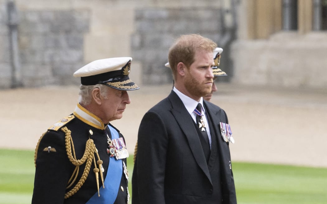 Britain's King Charles III (L) walks with his son Britain's Prince Harry, Duke of Sussex as they arrive at St George's Chapel inside Windsor Castle on September 19, 2022, ahead of the Committal Service for Britain's Queen Elizabeth II. Monday's committal service is expected to be attended by at least 800 people, most of whom will not have been at the earlier State Funeral at Westminster Abbey. (Photo by David Rose / POOL / AFP)