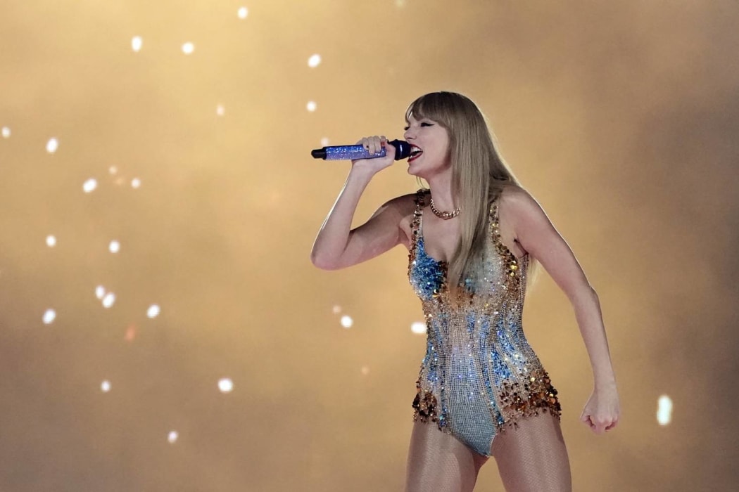 Taylor Swift on stage in the concert movie Taylor Swift: The Eras Tour
