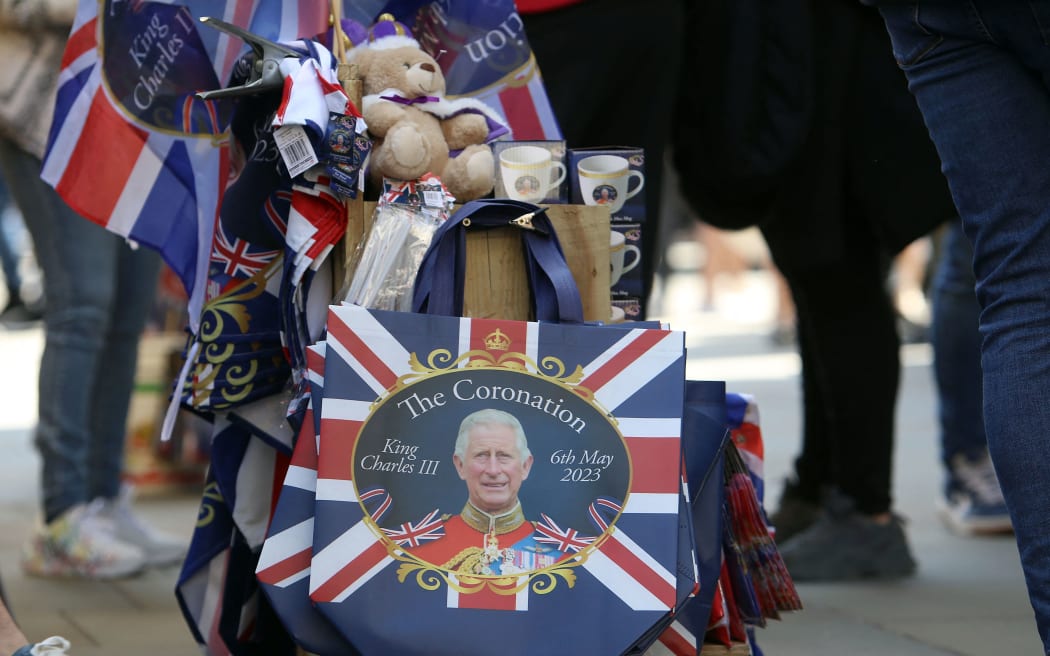 Royal souvenirs are seen for sale on a street in central London on April 29, 2023 ahead of the coronation ceremony of Charles III and his wife, Camilla, as King and Queen of the United Kingdom and Commonwealth Realm nations, on May 6, 2023. (Photo by Susannah Ireland / AFP)