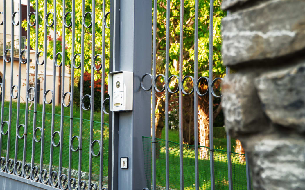 Metal gates and security camera.