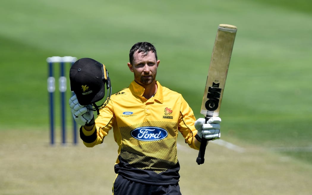 Firebirds Devon Conway celebrates 100 runs.