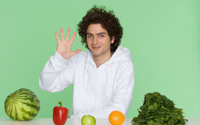 Young man with fruit and vegetables (Photo by NEIL GUEGAN / Image Source / Image Source via AFP)