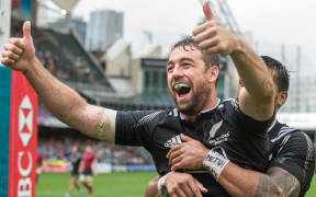 Kurt Baker celebrates his hat-trick against Wales.