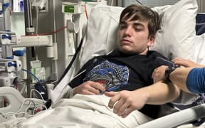 Palmerston North teenager Carson Harvey is seen in hospital after suffering a rare, deep brain bleed caused by arteriovenous malformation - tangled blood vessels - on 20 June, 2023. He will soon travel to the UK for the first of two surgeries there to treat the condition.
