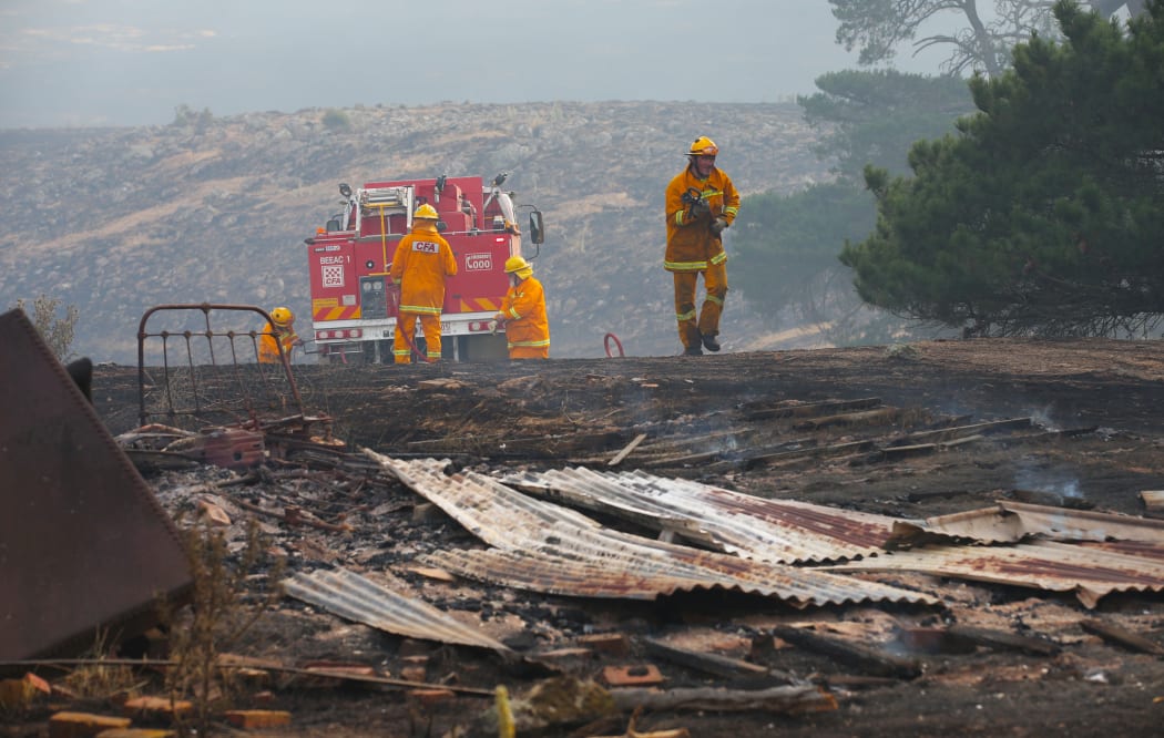 Firefighters work to contain a bushfire near Scotsburn, South of Ballarat in Victoria, Sunday, Dec 20.