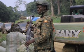 A soldier with the Uganda People's Defence Forces at a checkpoint on the Mbau-Kamango road in the territory of Beni.