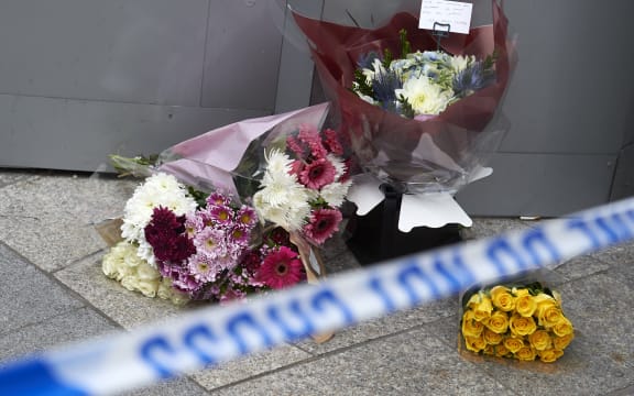 Flowers by the police cordon outside The Shard in London as a tribute to victims.