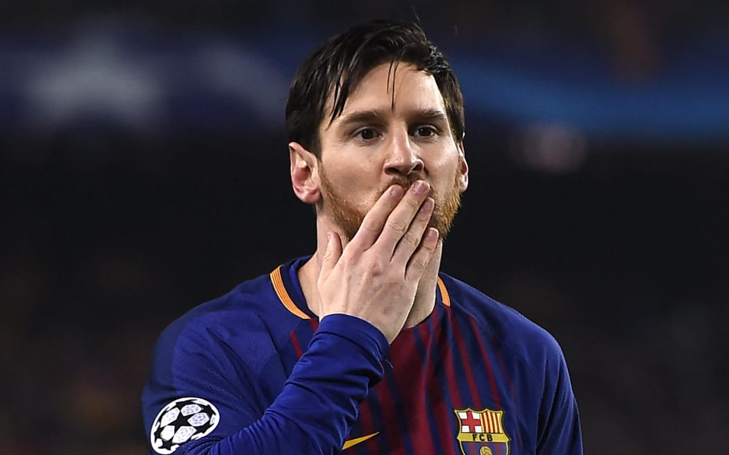 In this file photo taken on March 14, 2018 Barcelona's Argentinian forward Lionel Messi blows a kiss after scoring a goal during the UEFA Champions League round of sixteen second leg football match between FC Barcelona and Chelsea FC at the Camp Nou stadium in Barcelona.