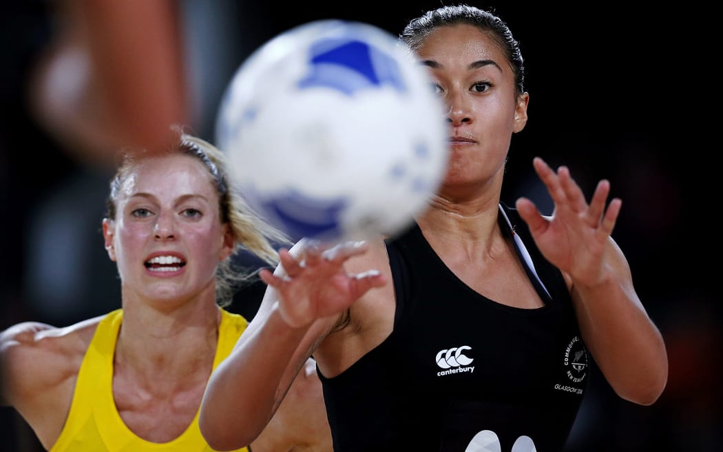Maria Tutaia of New Zealand beats Laura Geitz of Australia to the ball. Glasgow 2014 Commonwealth Games.