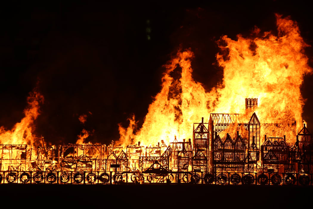 A replica of 17th-century London on a barge floating on the river Thames is set ablaze in an event to mark the 350th anniversary of the Great Fire of London.