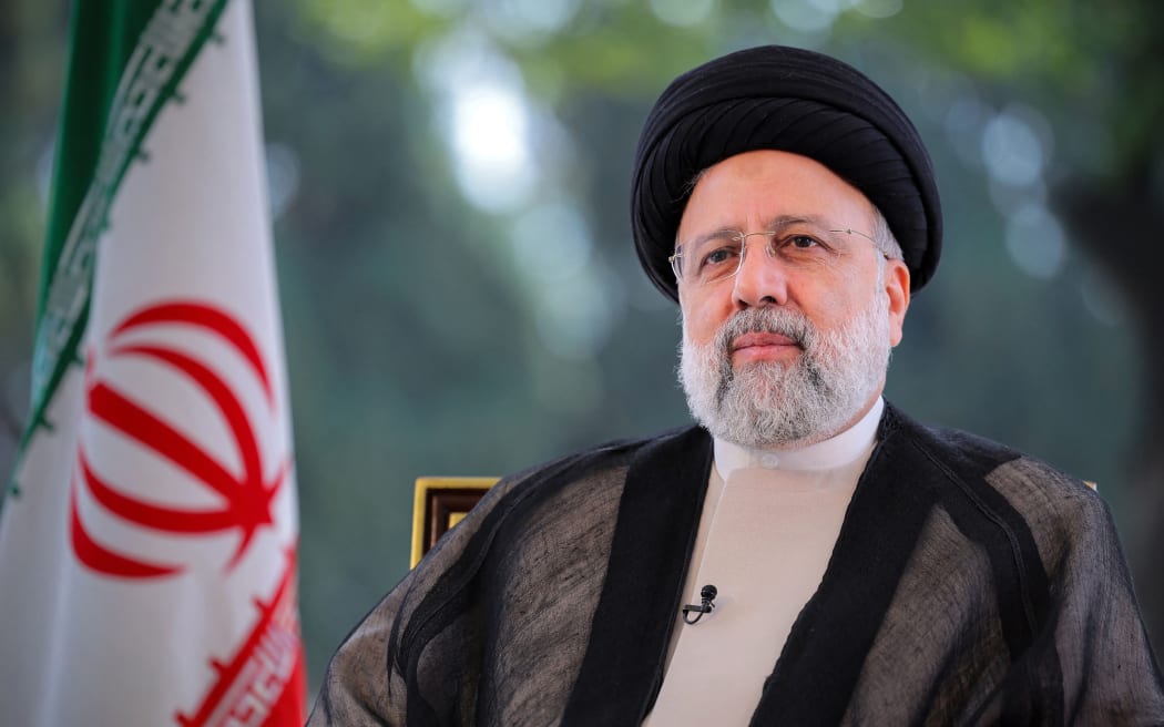 This handout picture provided by the Iranian presidency shows Iran's President Ebrahim Raisi shows him addressing and giving the annual address to the nation for Nowruz, the Persian New Year, in Tehran on March 20, 2024. (Photo by Iranian Presidency / AFP) / === RESTRICTED TO EDITORIAL USE - MANDATORY CREDIT "AFP PHOTO / HO / IRANIAN PRESIDENCY" - NO MARKETING NO ADVERTISING CAMPAIGNS - DISTRIBUTED AS A SERVICE TO CLIENTS ===