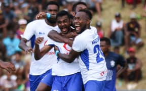 Lautoka's Praneel Naidu (c) celebrates his goal with teammates.