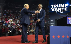 GLENDALE, ARIZONA - AUGUST 23: Republican presidential nominee, former U.S. President Donald Trump (L) embraces former presidential candidate Robert F. Kennedy Jr. during a campaign rally at Desert Diamond Arena on August 23, 2024 in Glendale, Arizona. Kennedy announced today that he was suspending his presidential campaign and supporting former President Trump.   Rebecca Noble/Getty Images/AFP (Photo by Rebecca Noble / GETTY IMAGES NORTH AMERICA / Getty Images via AFP)