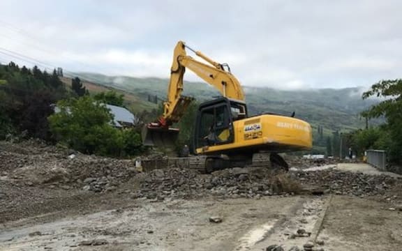 Contractors clearing Scotland Street, Roxburgh, after flooding on Sunday.
