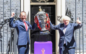 Rugby League World Cup 2021's Jon Dutton with Prime Minister Boris Johnson & The Paul Barriere Rugby League World Cup Trophy outside Downing St on 16/7/21.