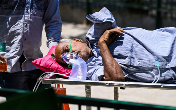A Covid-19 coronavirus patient leaves a hospital in New Delhi on April 24, 2021.