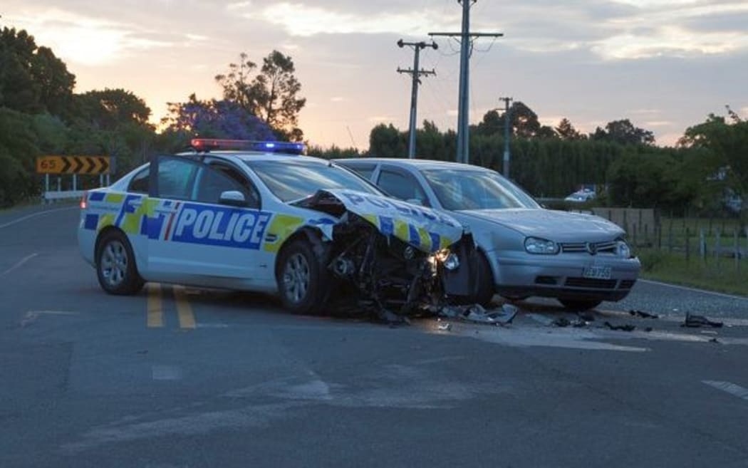 Three cars were written off after a festival-goer collided with a police car, which then hit another car.