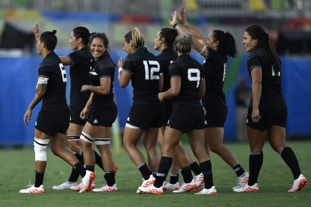 New Zealand's players celebrate their victory in the women’s rugby sevens match between New Zealand and Spain during the Rio 2016 Olympic Games at Deodoro Stadium in Rio de Janeiro on August 6, 2016.