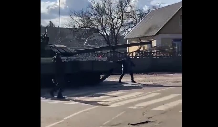 The video of a Ukrainian man kneeling in front of a Russian tank has been widely shared on social media.