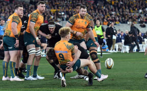 Wallabies halfback Tate McDermott is tackled by Scott Barrett during the first Bledisloe Cup test, Melbourne,  2023